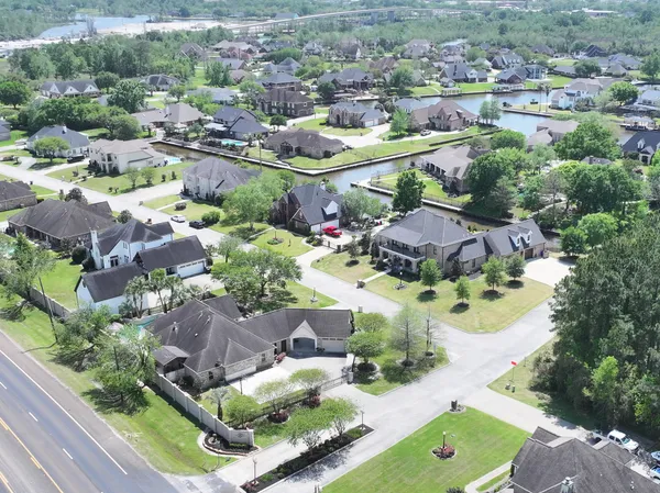an aerial view of a residential houses with outdoor space