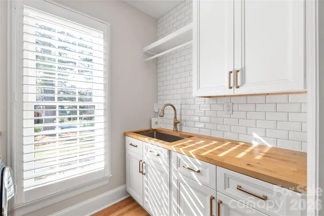 a kitchen with a sink and a window