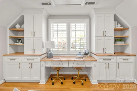 a dining table with chair and window