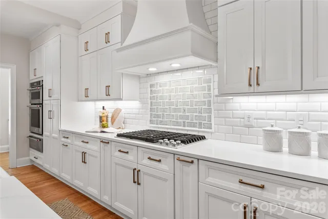 a kitchen with cabinets and appliances