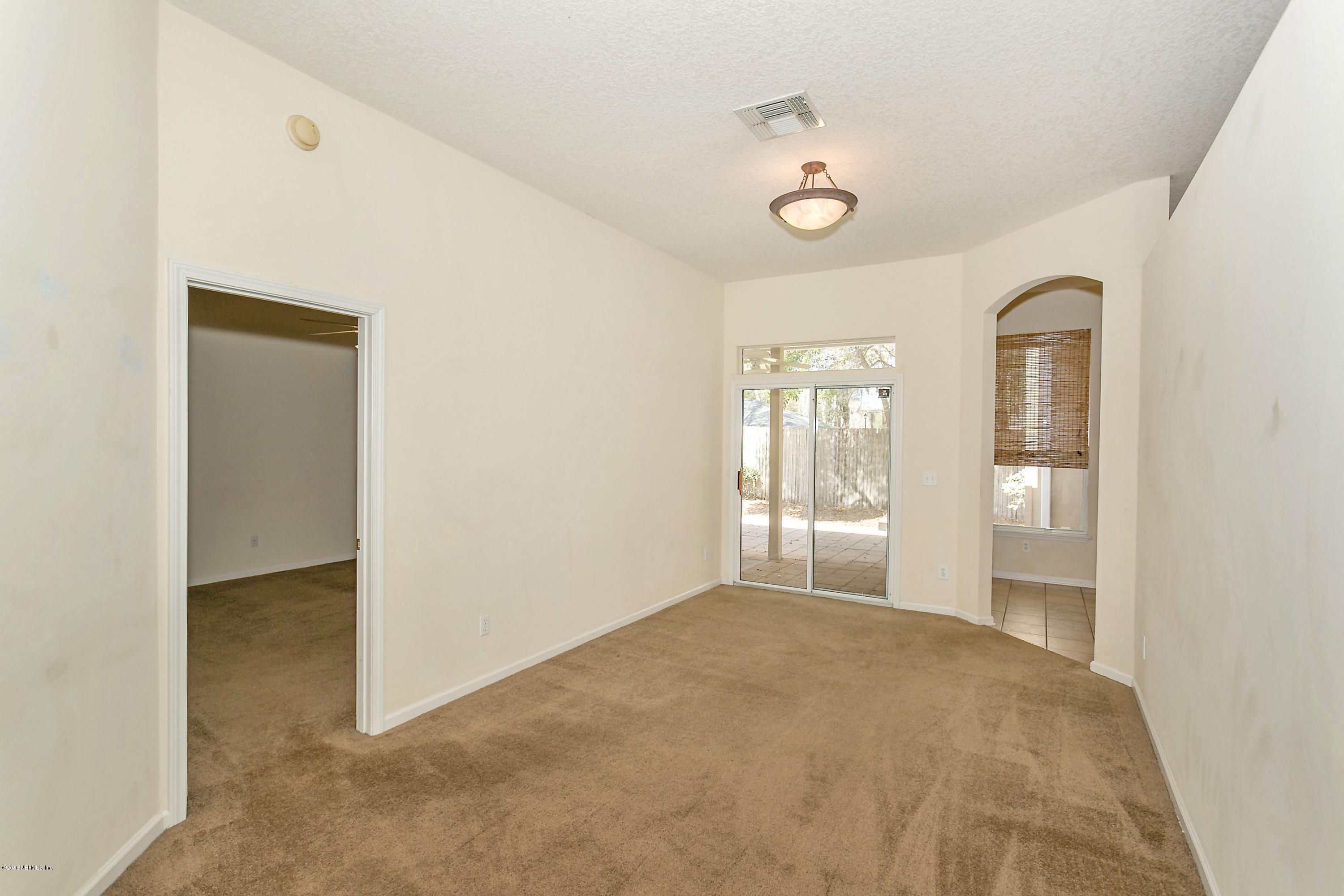 2809 Hidden Stagecoach Road Jacksonville, FL 32223 - Photo 11 of 25 a view of an empty room with a window