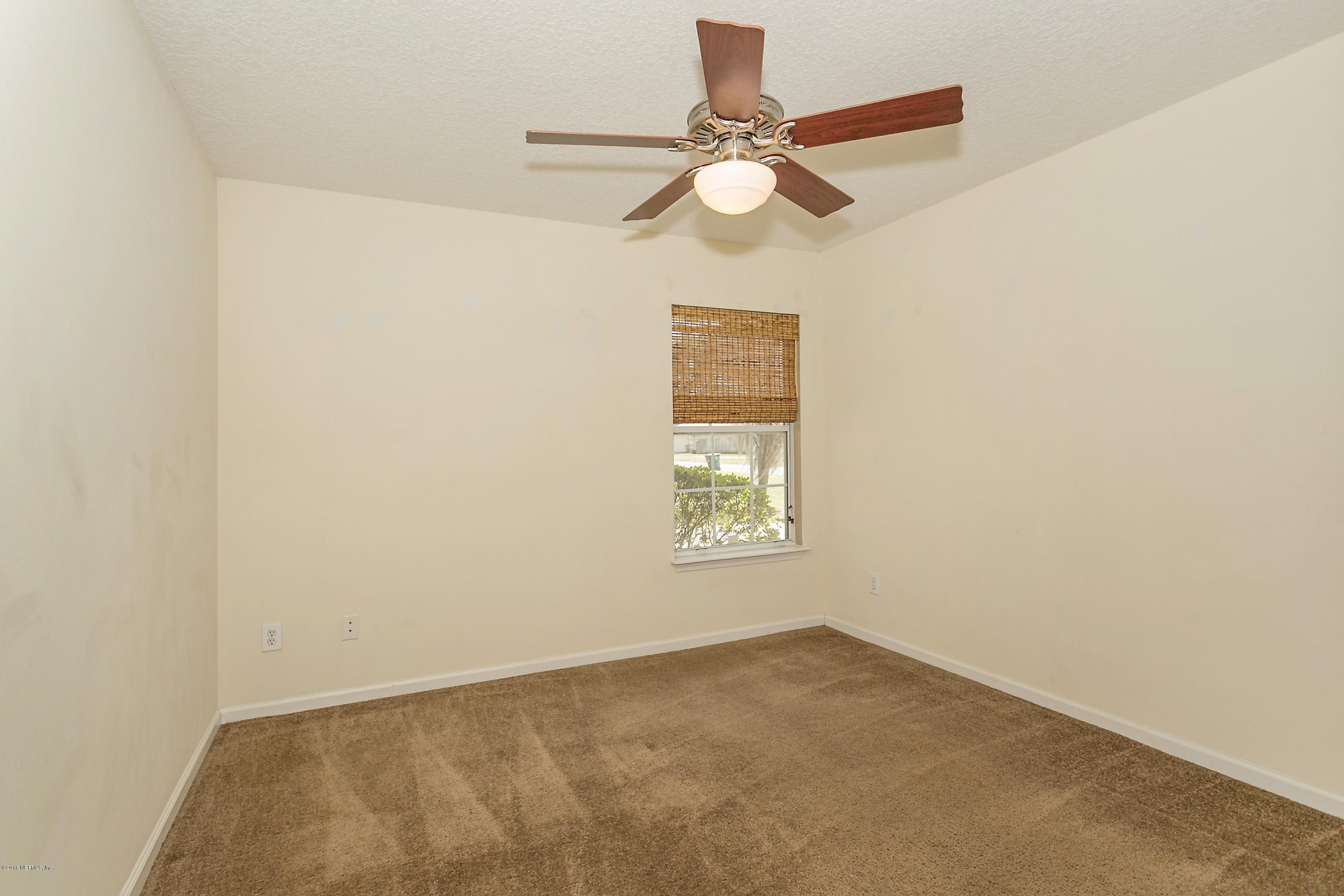2809 Hidden Stagecoach Road Jacksonville, FL 32223 - Photo 19 of 25 a view of an empty room with a window