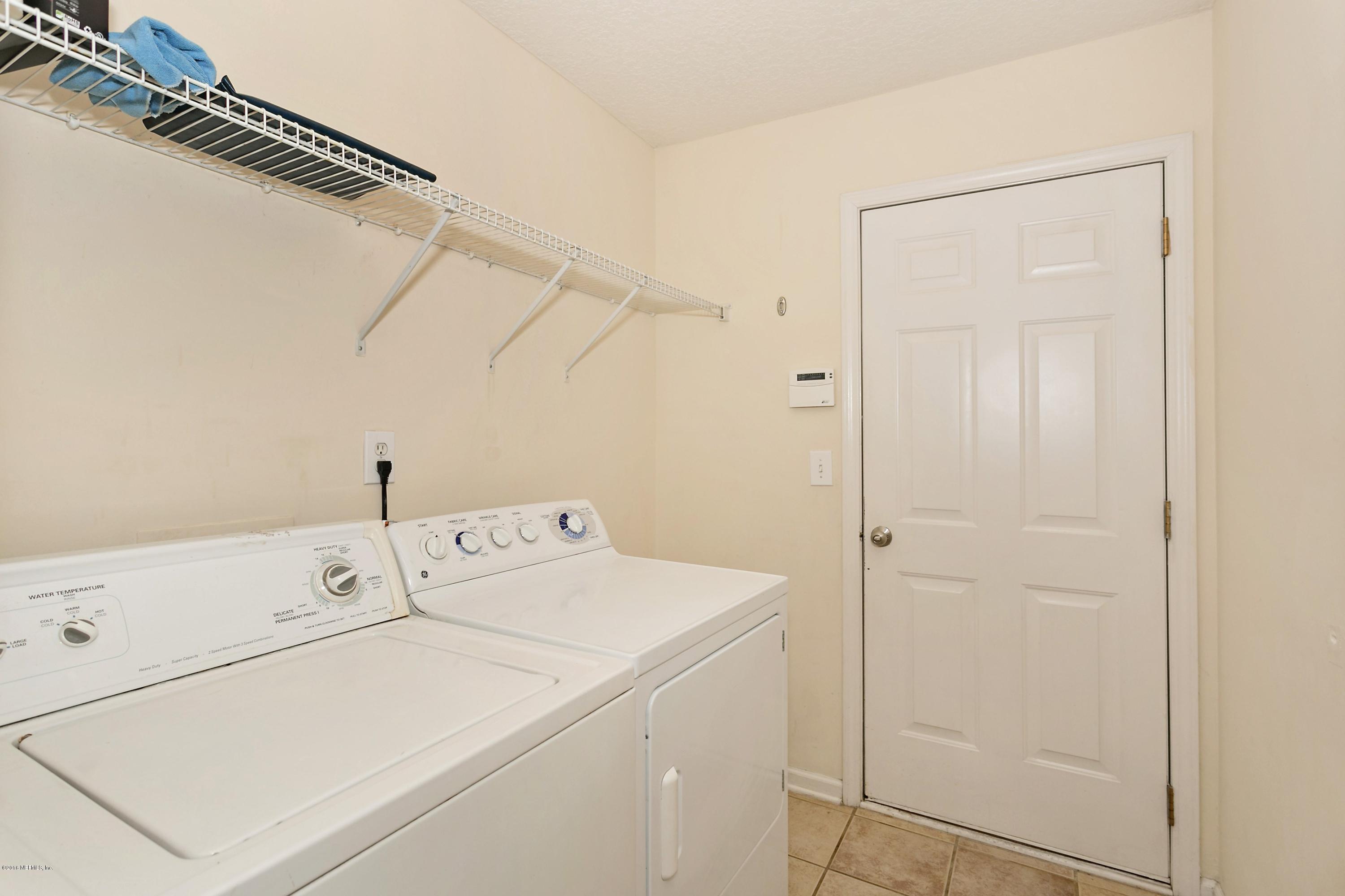 2809 Hidden Stagecoach Road Jacksonville, FL 32223 - Photo 20 of 25 a utility room with dryer and washer