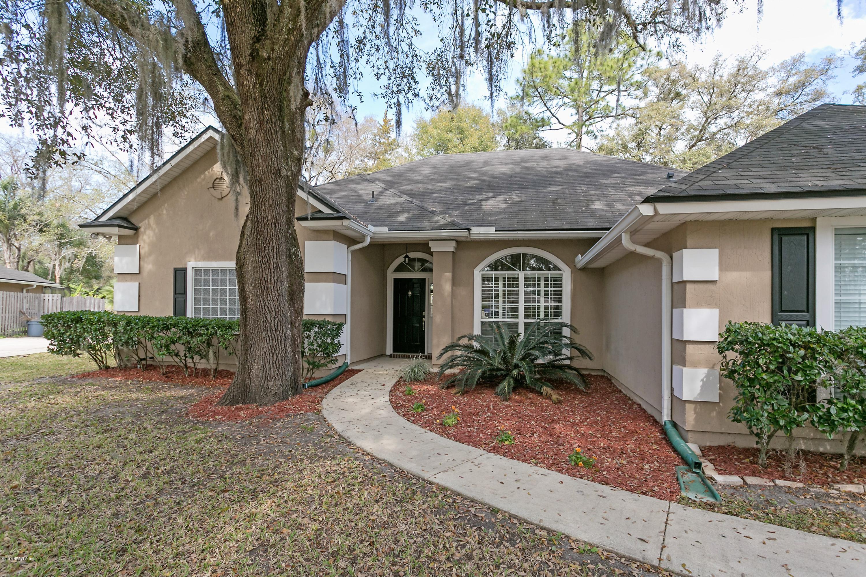 2809 Hidden Stagecoach Road Jacksonville, FL 32223 - Photo 2 of 25 a front view of a house with garden