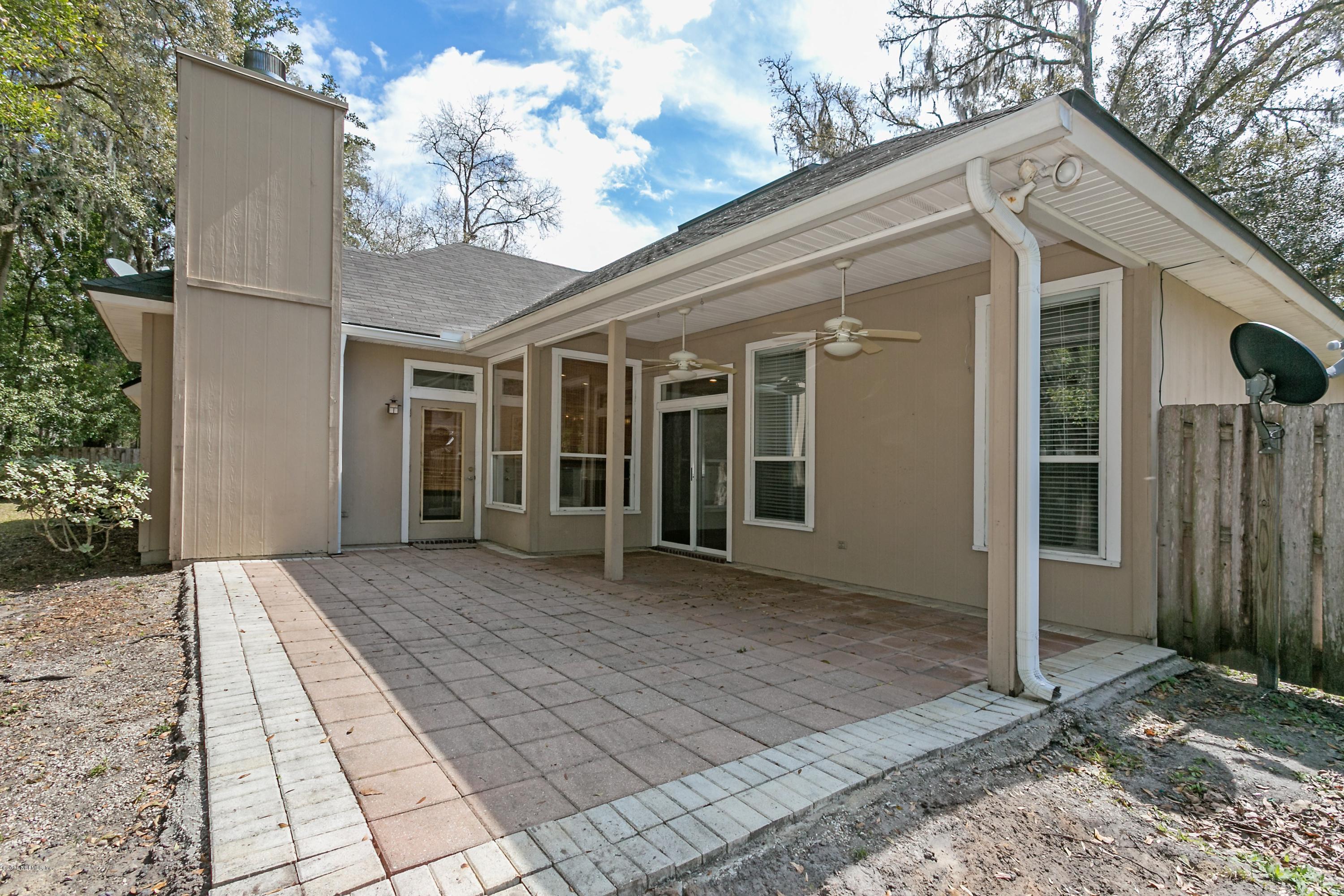 2809 Hidden Stagecoach Road Jacksonville, FL 32223 - Photo 21 of 25 a view of a house with a yard