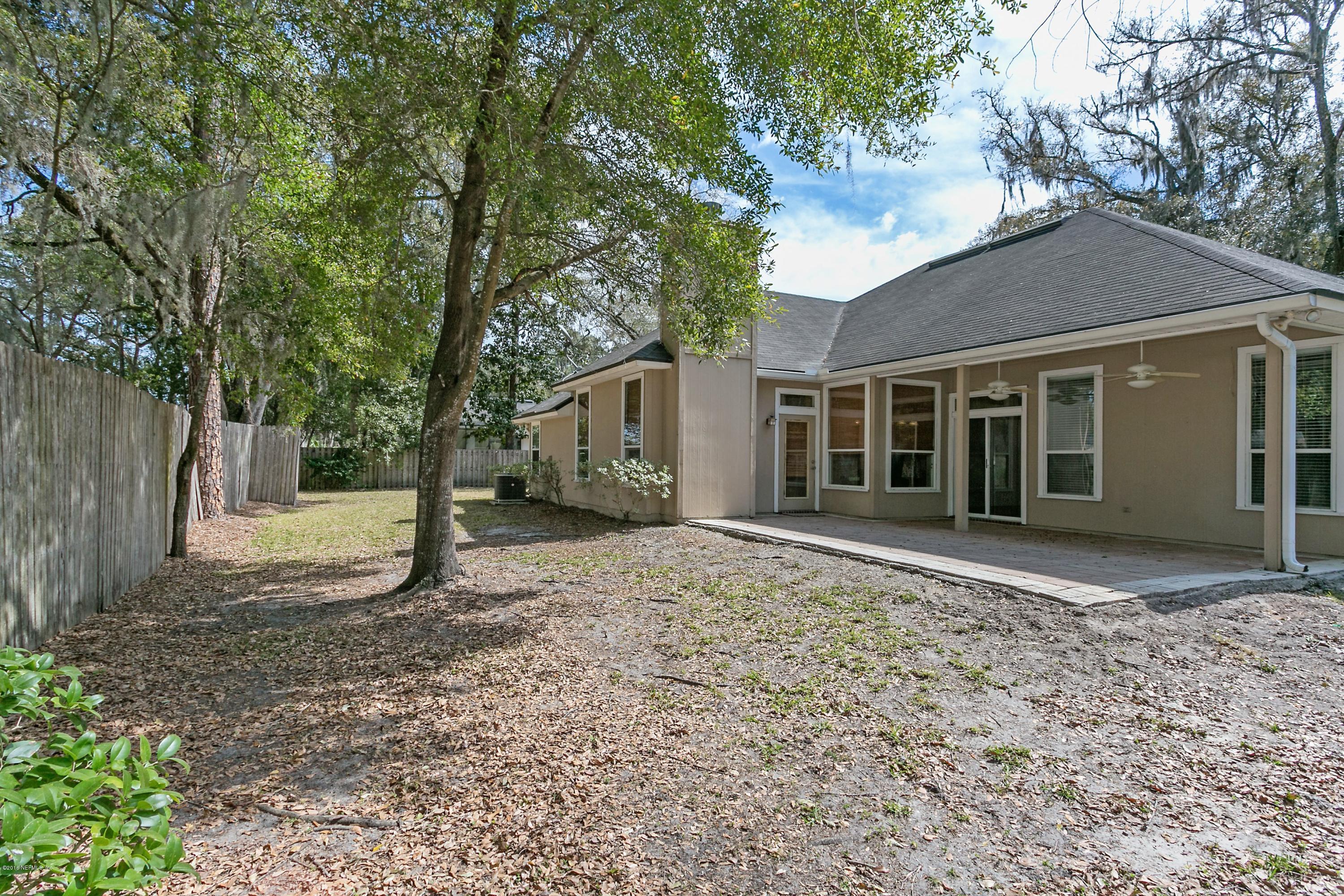 2809 Hidden Stagecoach Road Jacksonville, FL 32223 - Photo 22 of 25 a view of a house with a yard