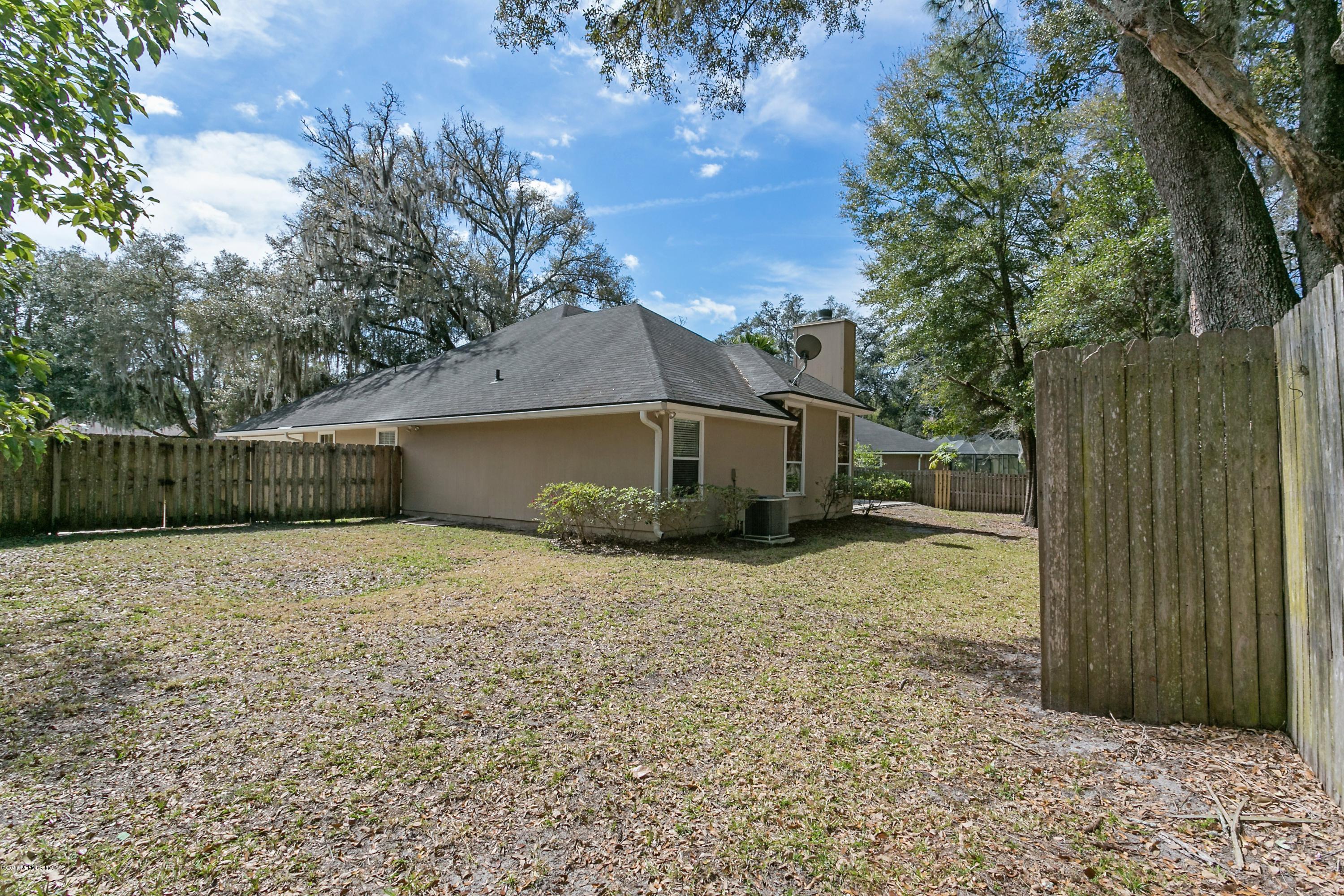 2809 Hidden Stagecoach Road Jacksonville, FL 32223 - Photo 23 of 25 a backyard of a house