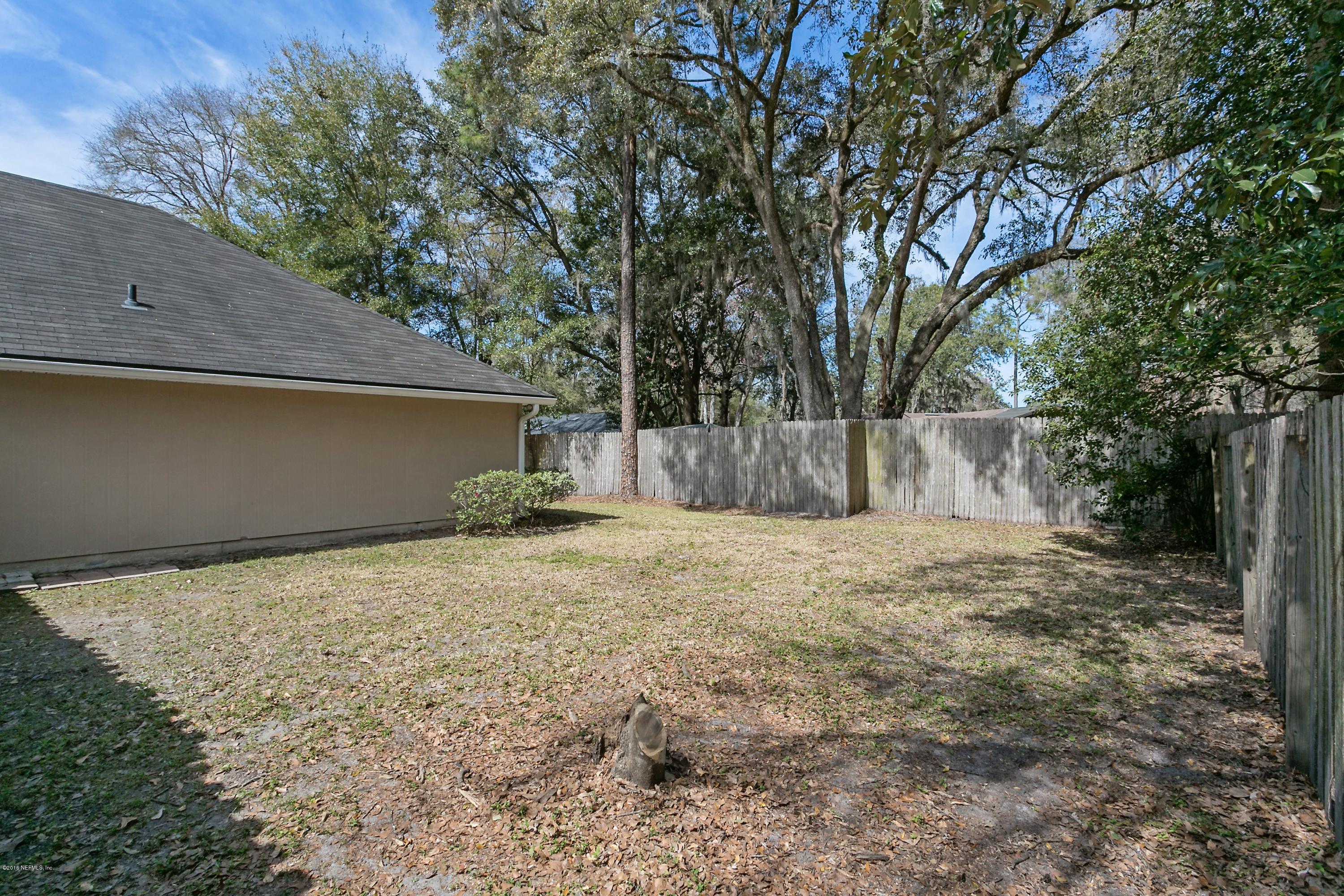 2809 Hidden Stagecoach Road Jacksonville, FL 32223 - Photo 24 of 25 a backyard of a house