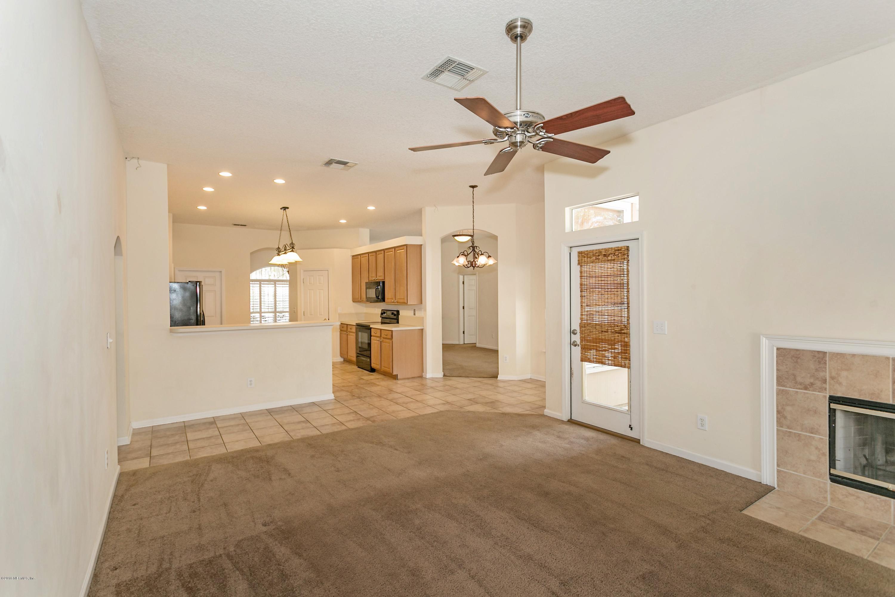 2809 Hidden Stagecoach Road Jacksonville, FL 32223 - Photo 3 of 25 a view of a livingroom with a kitchen