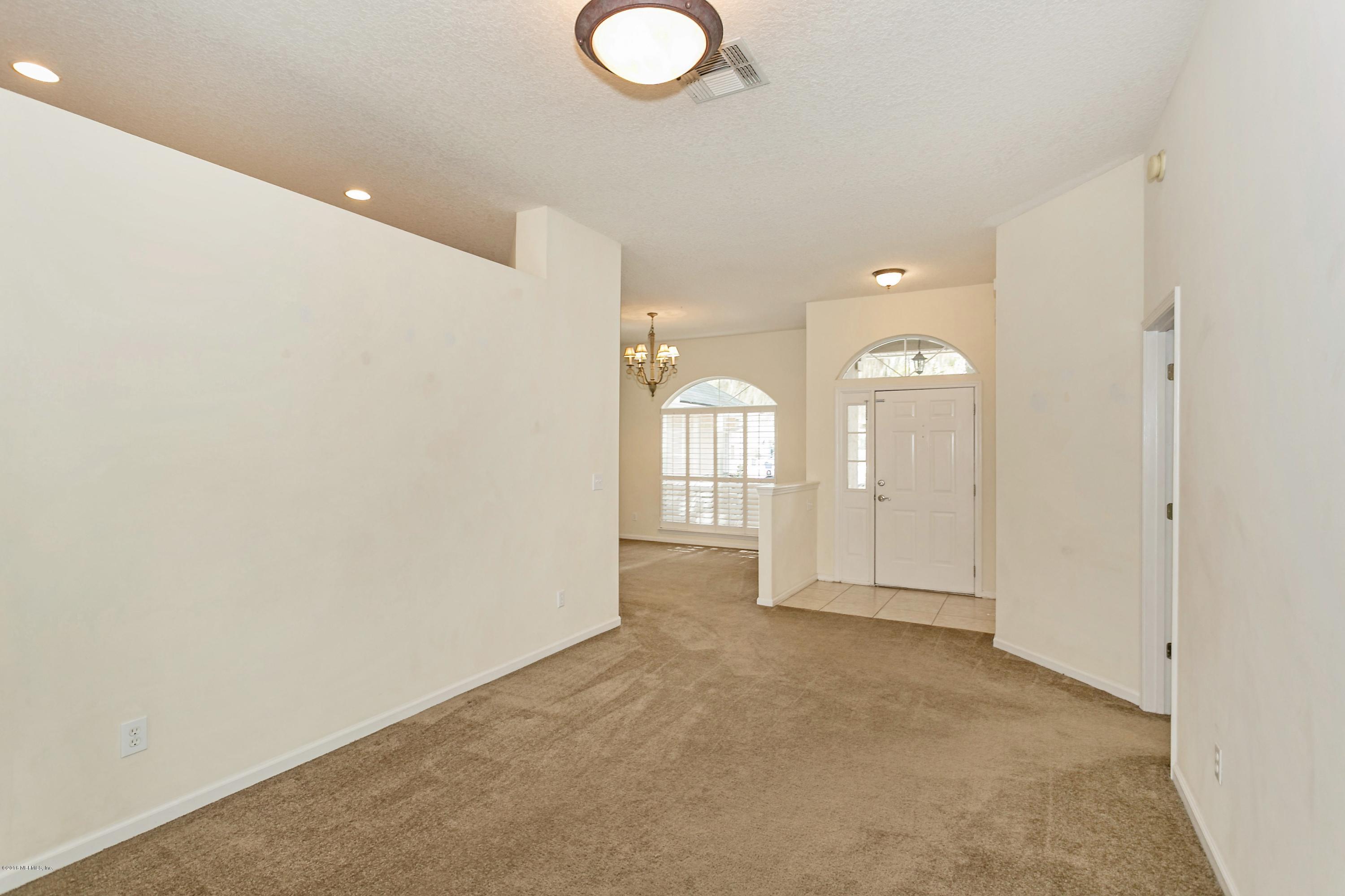 2809 Hidden Stagecoach Road Jacksonville, FL 32223 - Photo 10 of 25 a view of a livingroom with wooden floor