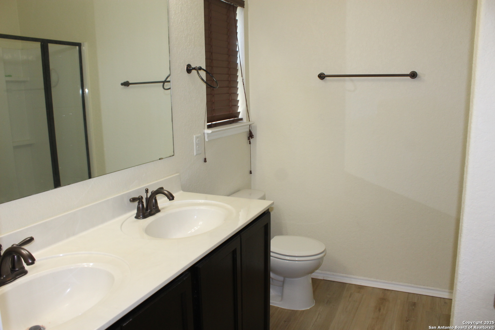 482 Walnut Crest Selma, TX 78154 - Photo 14 of 19 a bathroom with a sink toilet and vanity