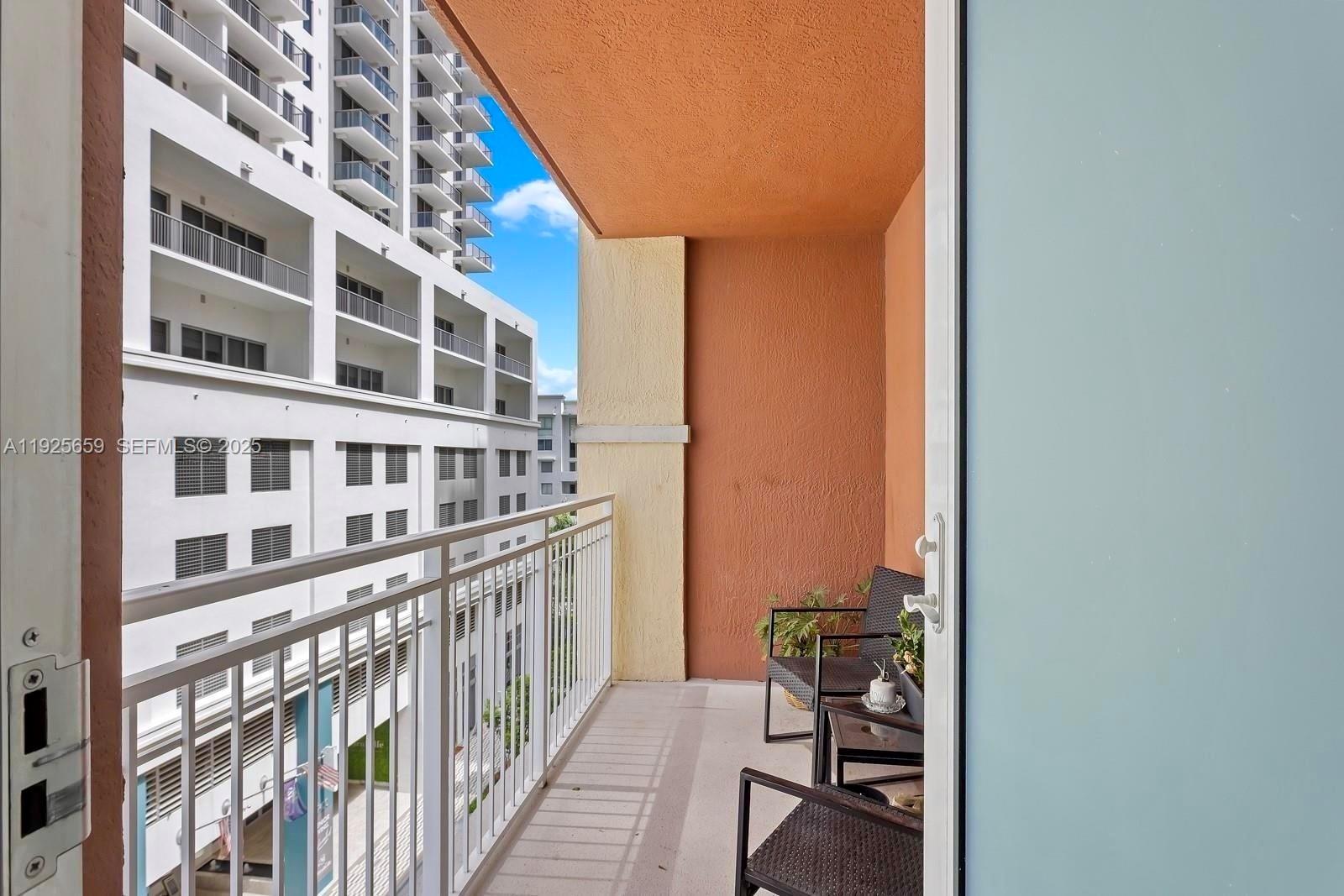 7350 Southwest 89th Street, Unit 607S Miami, FL 33156 - Photo 5 of 19 a view of a building from a balcony