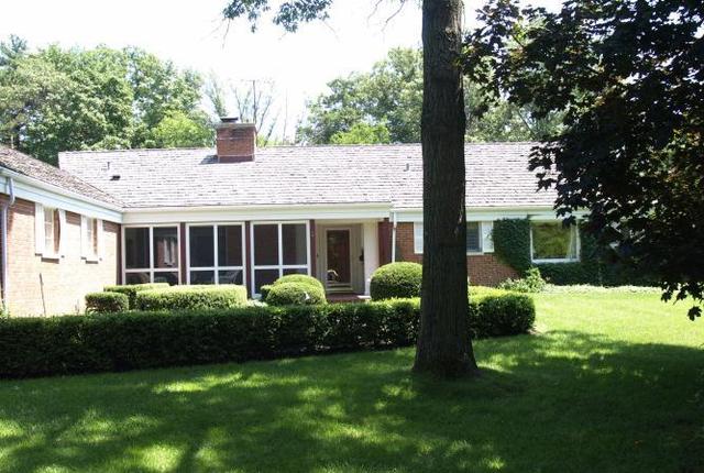 Undisclosed Address Winnetka, IL 60093 - Photo 1 of 1 a view of a house with a yard and plants