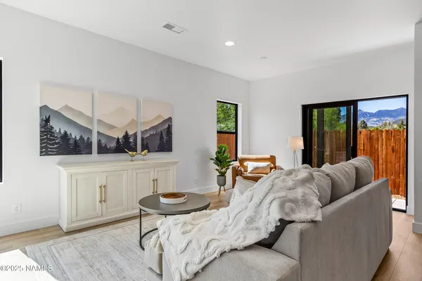 a living room with furniture and a rug