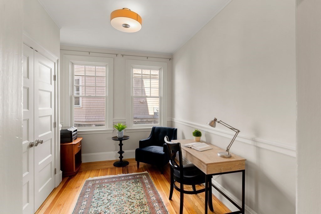 106 Westbourne Terrace, Unit 1 Brookline, MA 02446 - Photo 11 of 22 a living room with furniture and a window