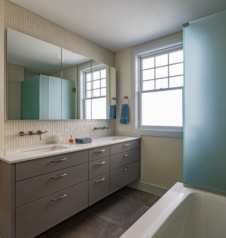 106 Westbourne Terrace, Unit 1 Brookline, MA 02446 - Photo 13 of 22 a bathroom with a double vanity sink window and mirror