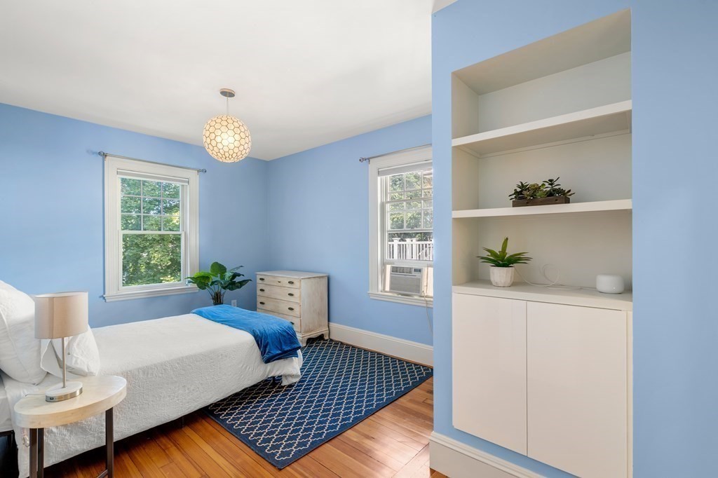 106 Westbourne Terrace, Unit 1 Brookline, MA 02446 - Photo 15 of 22 a bedroom with furniture and a window