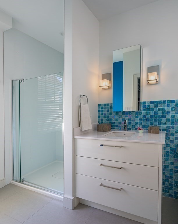 106 Westbourne Terrace, Unit 1 Brookline, MA 02446 - Photo 17 of 22 a bathroom with a sink and mirror
