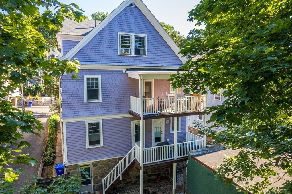 106 Westbourne Terrace, Unit 1 Brookline, MA 02446 - Photo 18 of 22 a view of a house with brick walls and plants