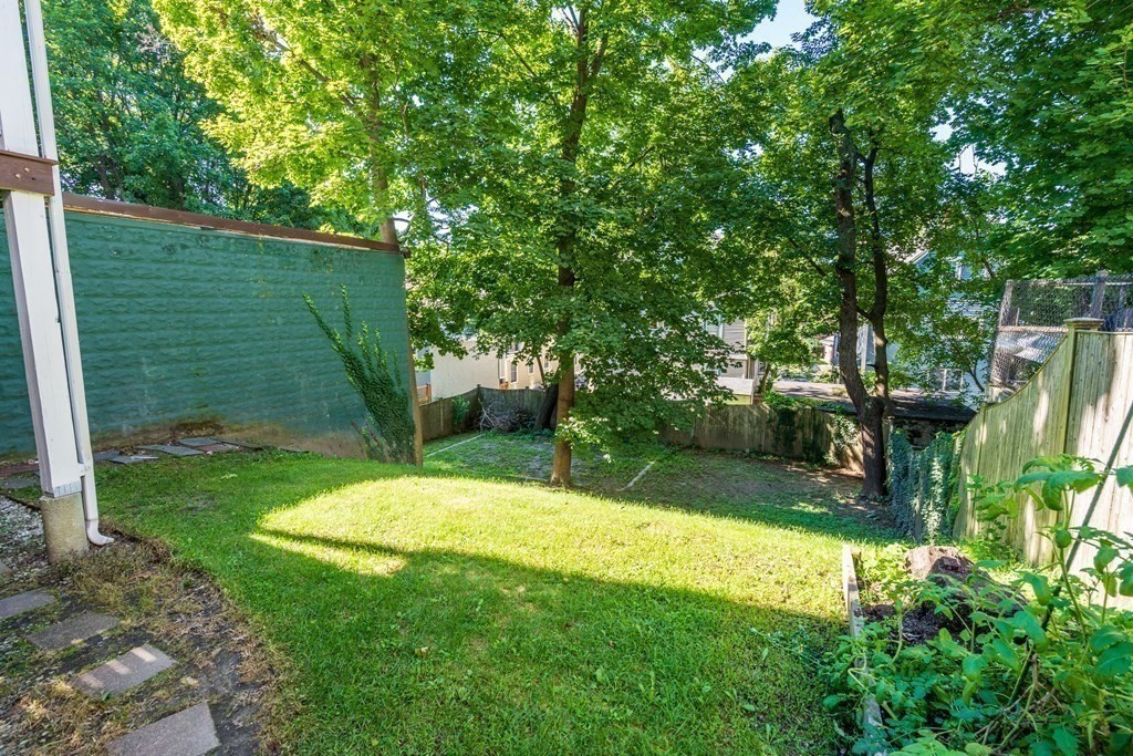 106 Westbourne Terrace, Unit 1 Brookline, MA 02446 - Photo 20 of 22 a view of a backyard with a small cabin