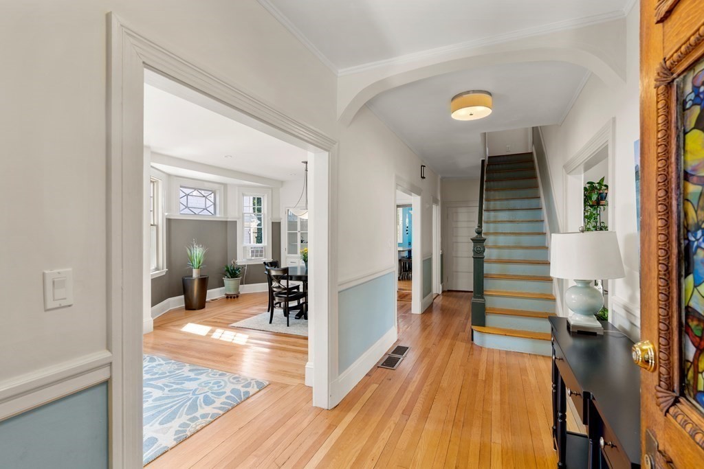 106 Westbourne Terrace, Unit 1 Brookline, MA 02446 - Photo 3 of 22 a view of a living room and kitchen with a large window