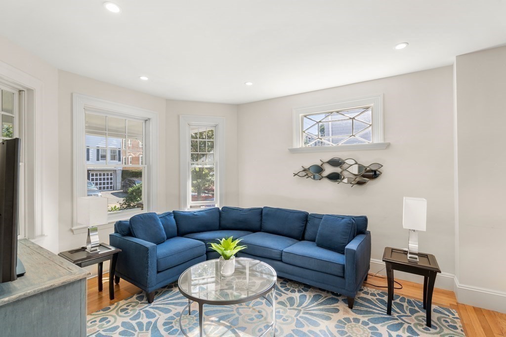 106 Westbourne Terrace, Unit 1 Brookline, MA 02446 - Photo 7 of 22 a living room with furniture and a wooden floor