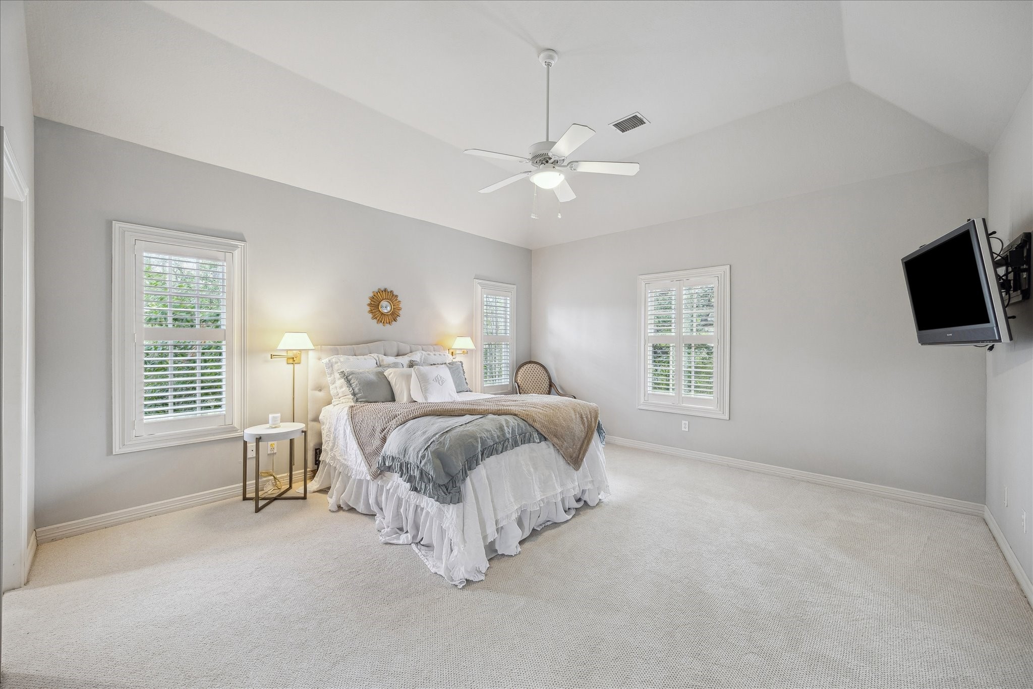 11524 Taylorcrest Road Houston, TX 77024 - Photo 36 of 47 The spacious third upstairs bedroom overlooks the front yard and features plantation shutters, a built-in desk, new carpet, high ceilings, a walk-in closet, and an adjoining bathroom.