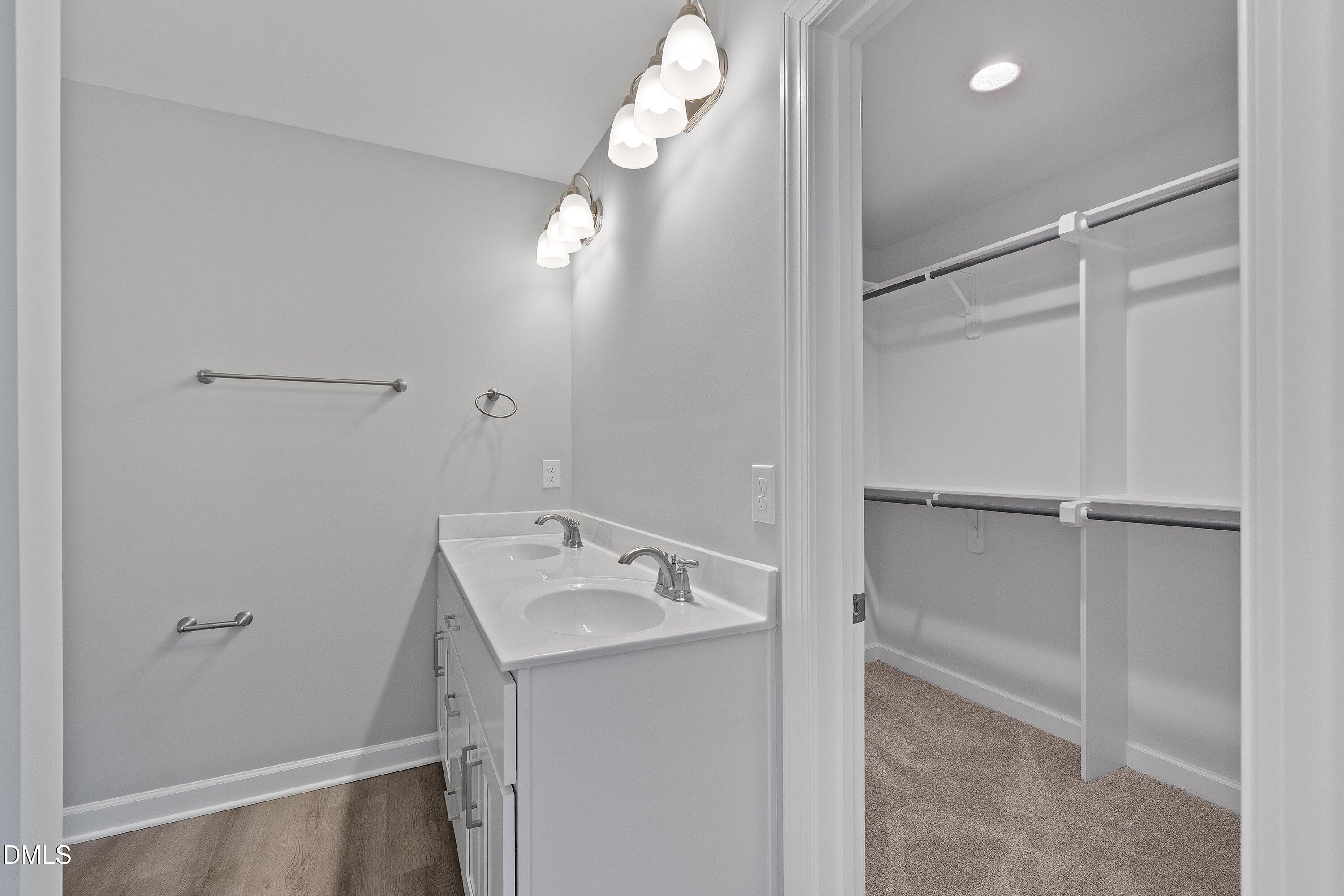 1808 Falls Landing Drive Raleigh, NC 27614 - Photo 14 of 23 a view of a bathroom with a sink dryer and washer