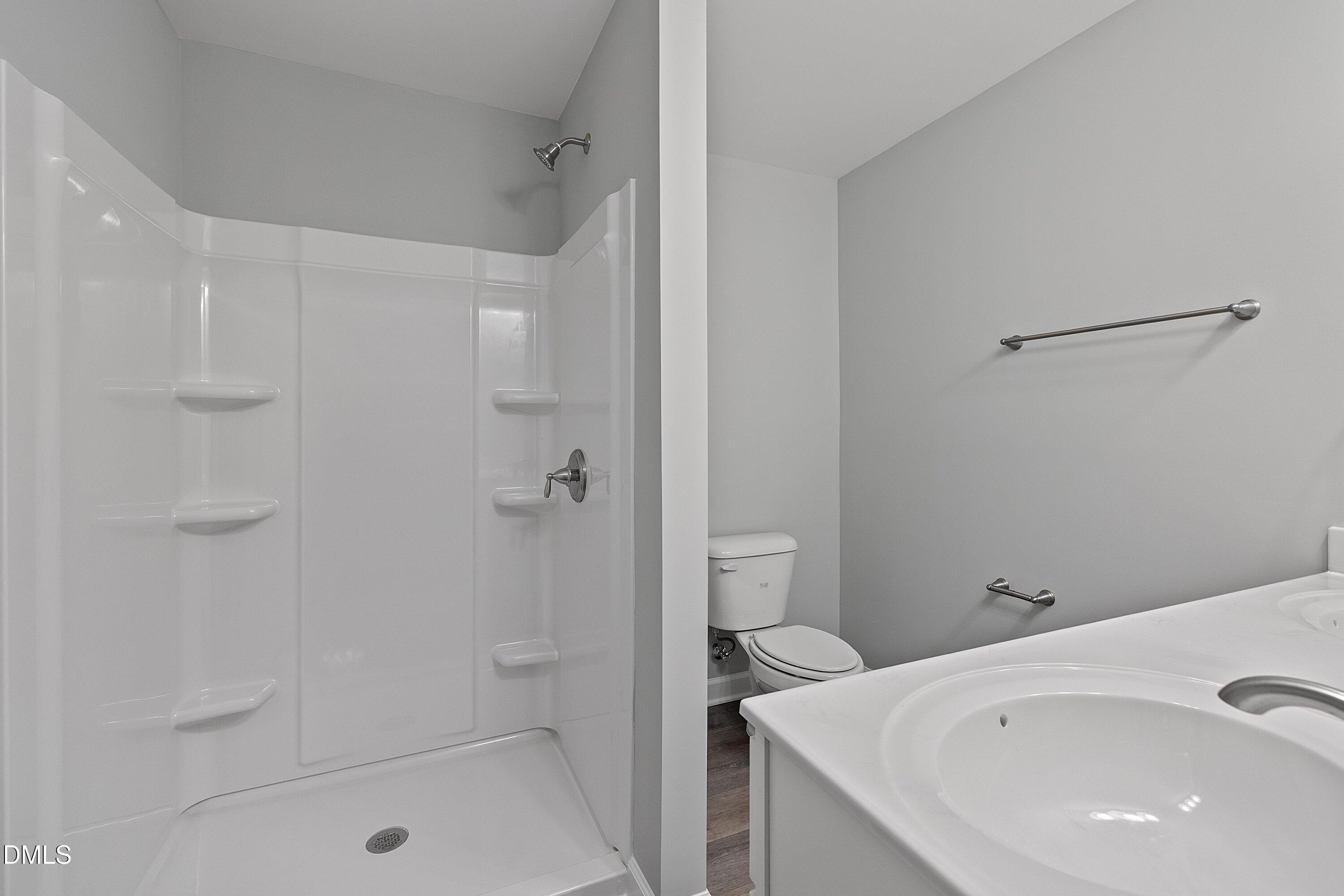 1808 Falls Landing Drive Raleigh, NC 27614 - Photo 15 of 23 a bathroom with a bathtub and a shower