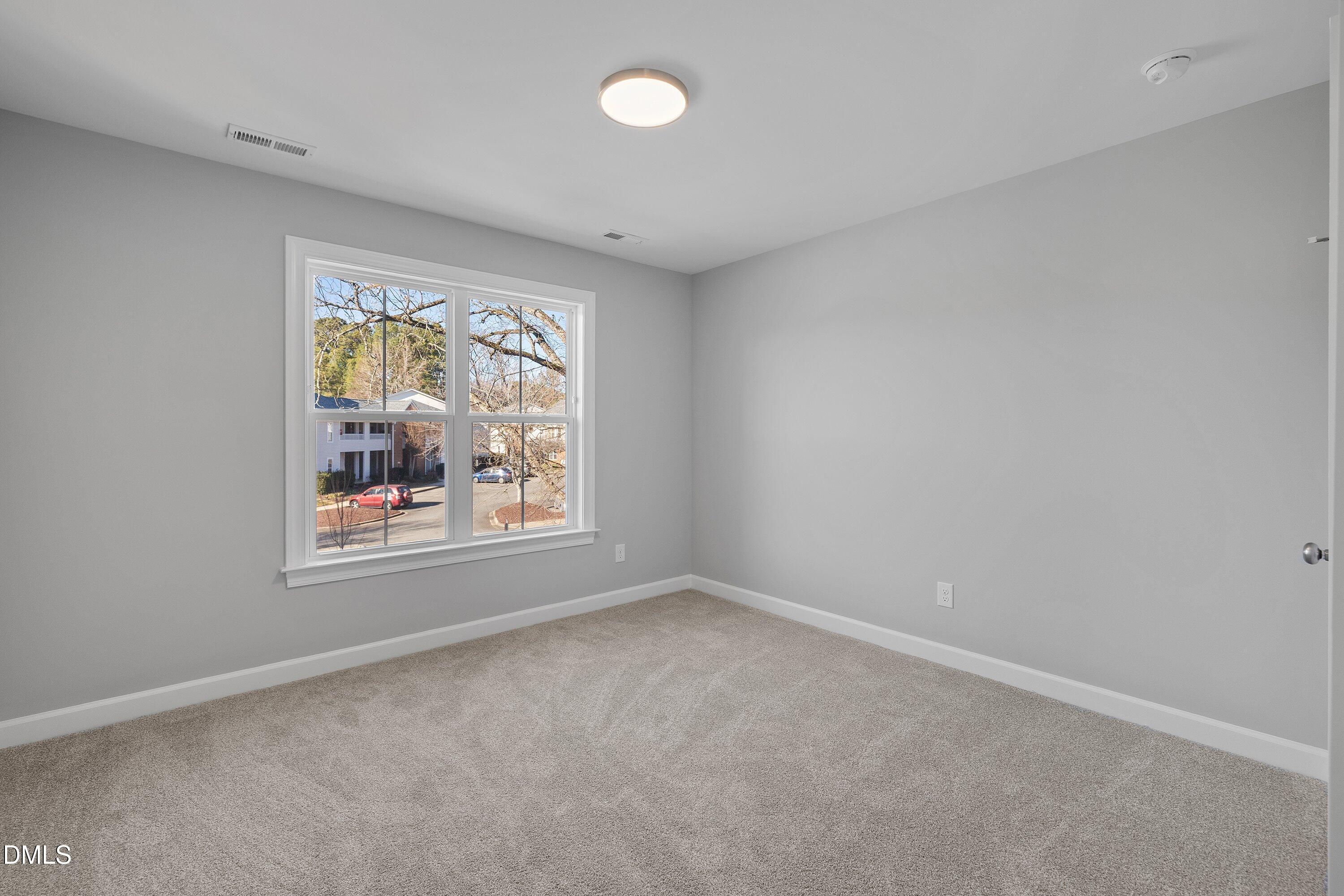 1808 Falls Landing Drive Raleigh, NC 27614 - Photo 17 of 23 an empty room with a window