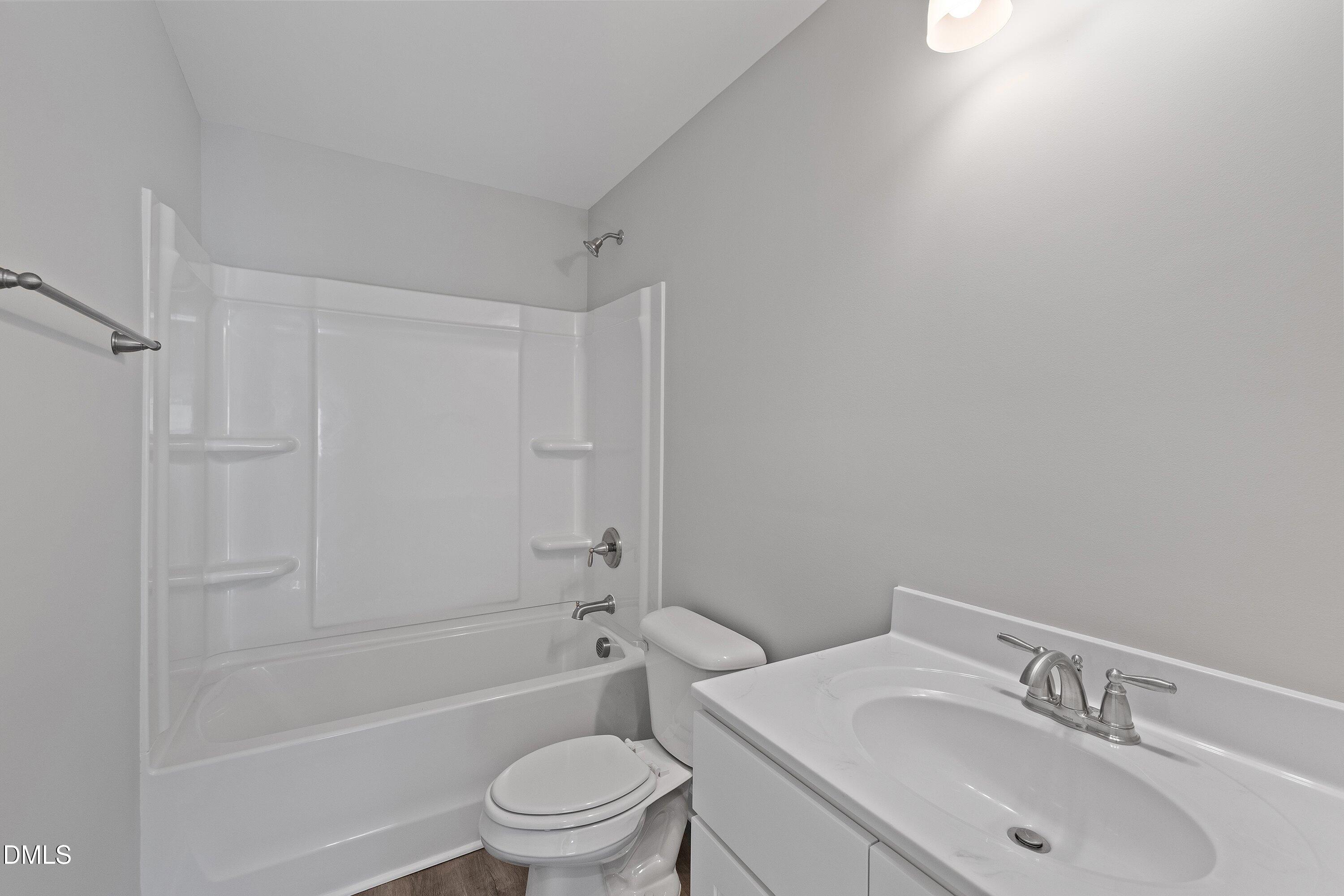 1808 Falls Landing Drive Raleigh, NC 27614 - Photo 19 of 23 a bathroom with a sink toilet and shower