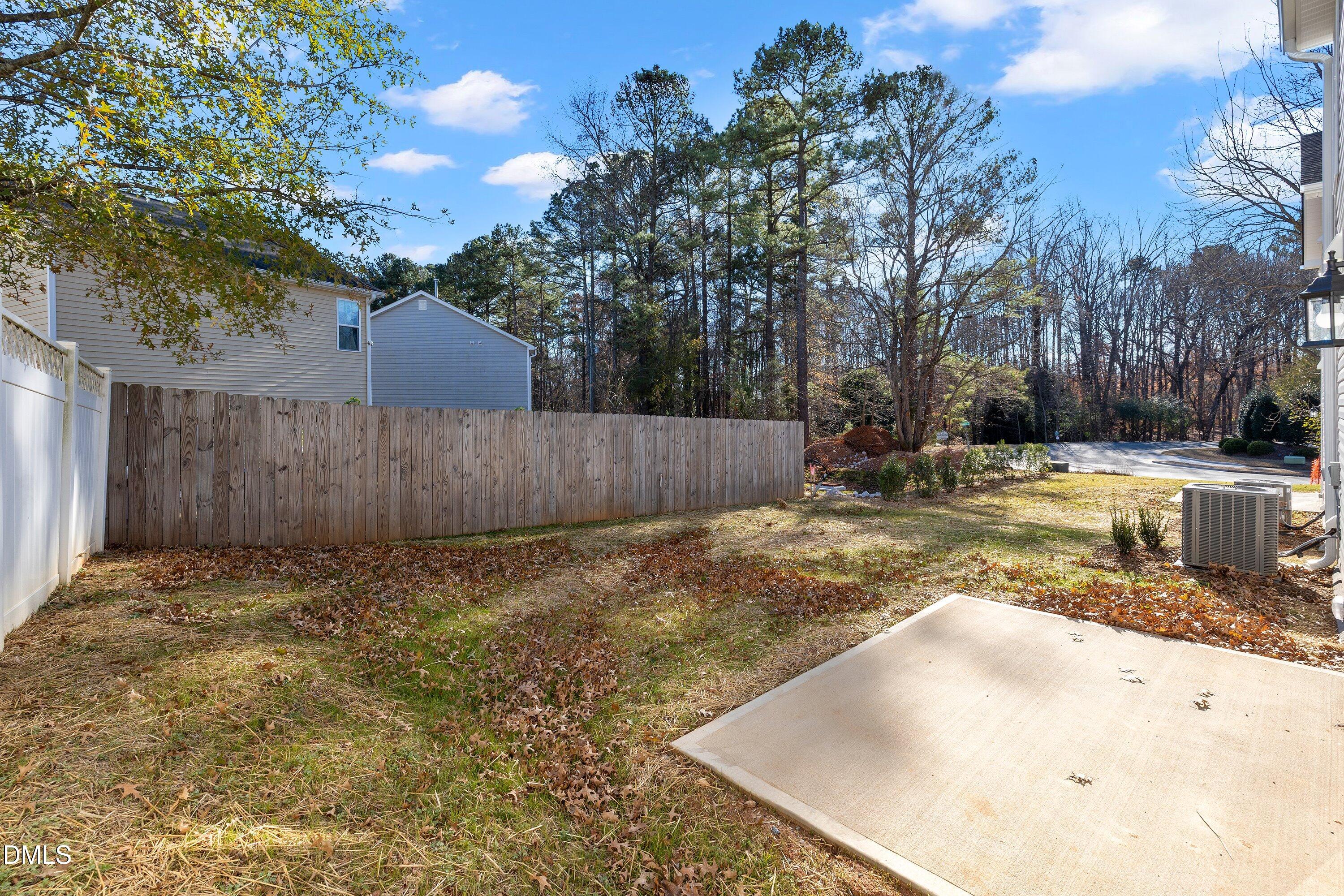 1808 Falls Landing Drive Raleigh, NC 27614 - Photo 21 of 23 a view of a backyard with wooden fence