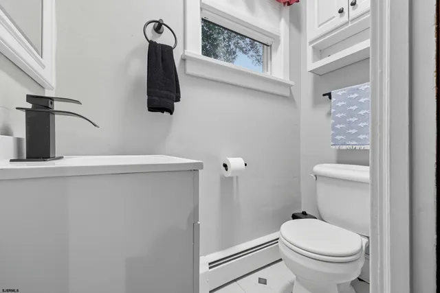 a bathroom with a toilet and a sink