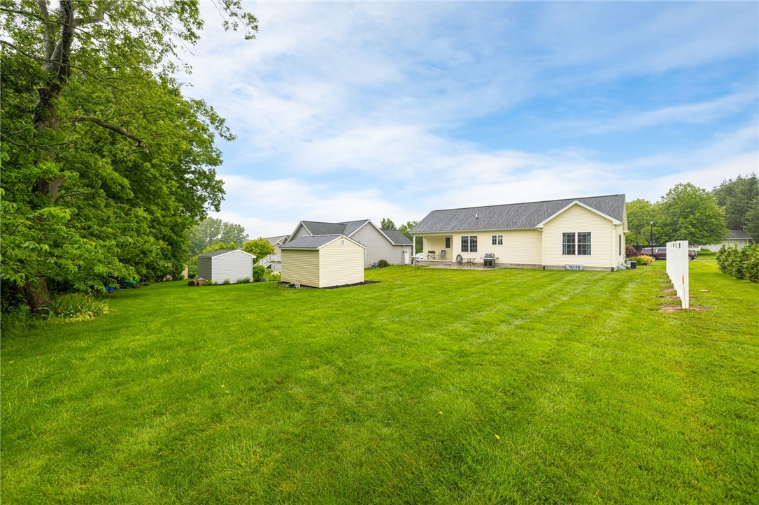 86 Parnell Drive Riga, NY 14428 - Photo 30 of 30 Spacious Yard with Partial Privacy fence
