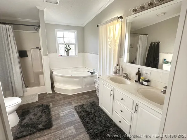 a room with a bed and a television