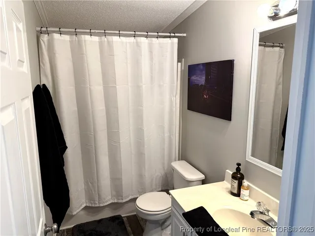 a view of a house with backyard and chairs