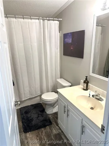 a view of a house with backyard and chairs