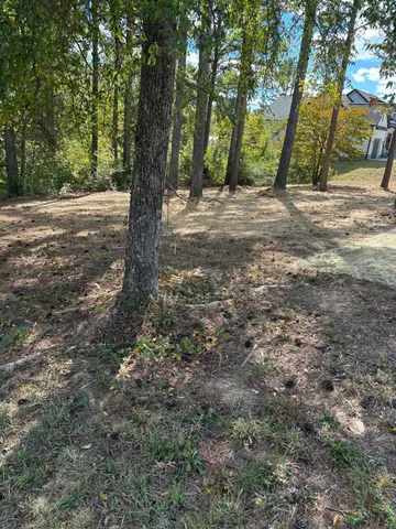 a view of a workspace with furniture and wooden floor