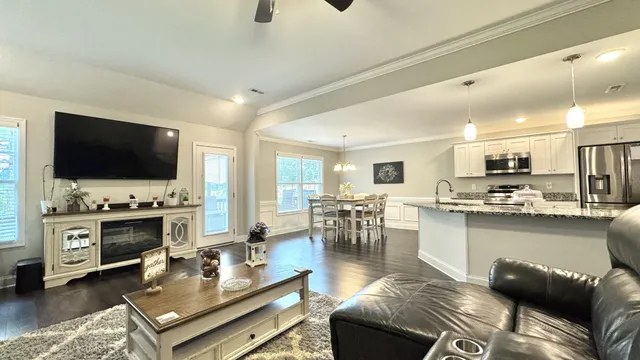 a view of a dining room with furniture window and wooden floor