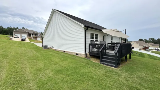 a wooden bench sitting in middle of the grass