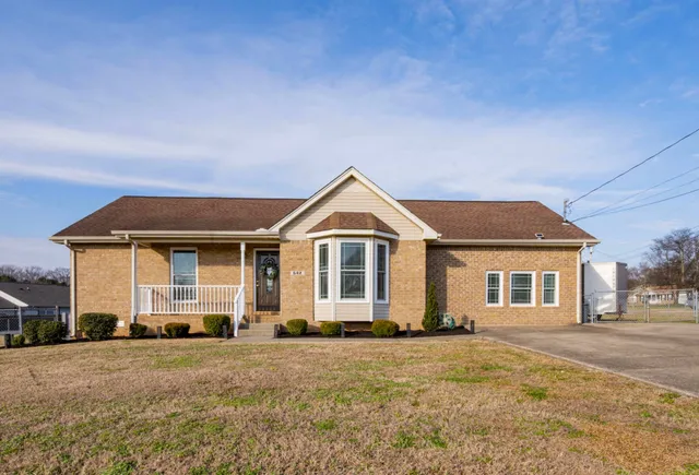 a front view of a house with yard