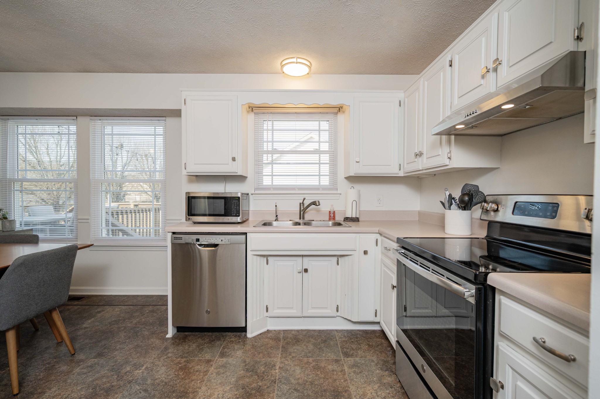 642 Rock Springs Road Smyrna, TN 37167 - Photo 19 of 49 a kitchen with granite countertop white cabinets and white appliances