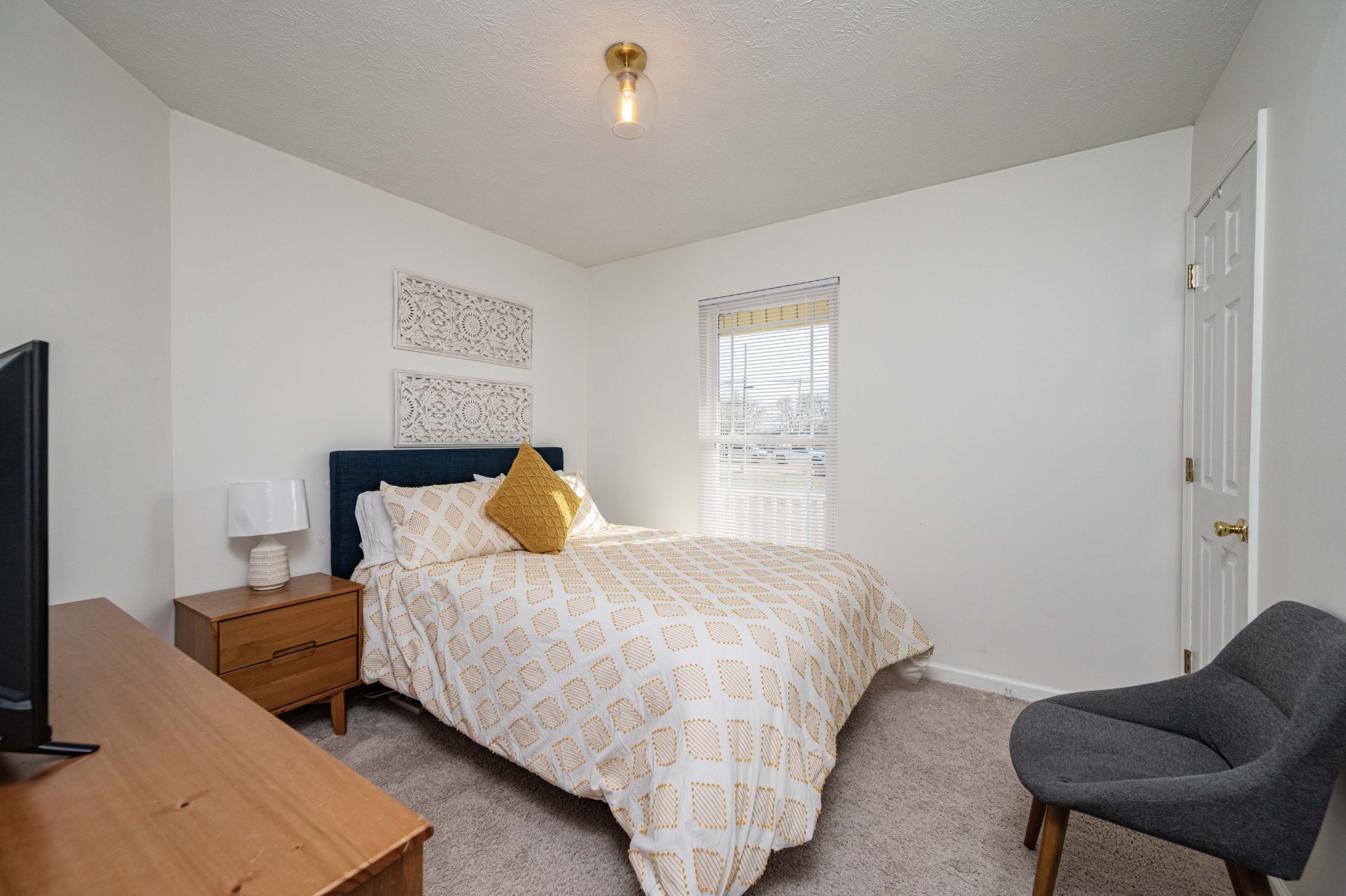 642 Rock Springs Road Smyrna, TN 37167 - Photo 34 of 49 a bedroom with a bed and chair