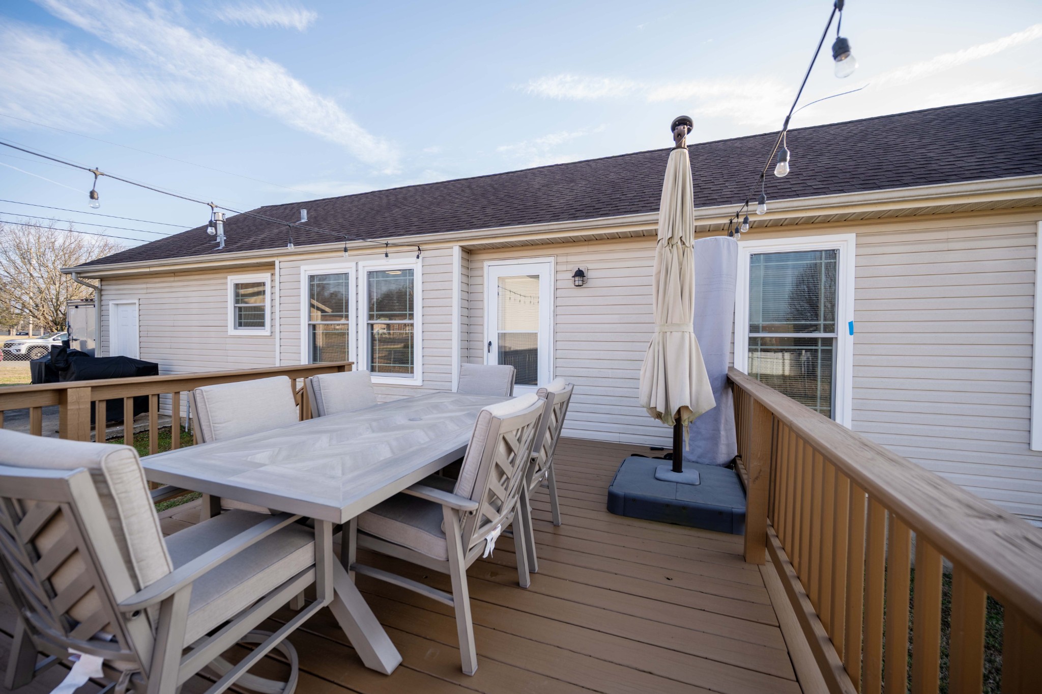 642 Rock Springs Road Smyrna, TN 37167 - Photo 44 of 49 a view of a deck with table and chairs with wooden floor and fence