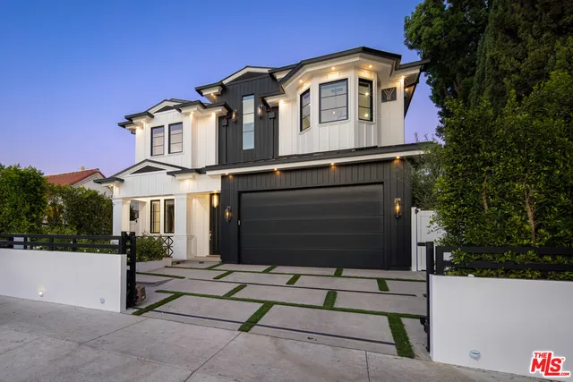 a front view of a house with a garage