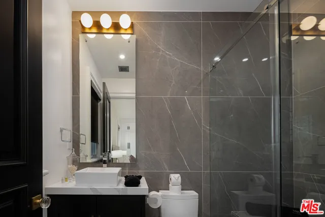 an aerial view of residential houses with city view