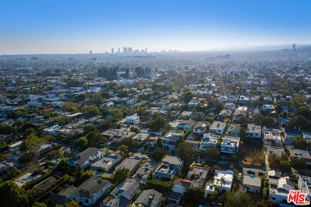 a bedroom with bed and a window