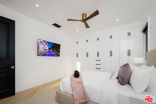 a view of a furniture and chandelier in a room