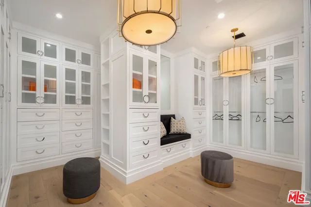 a bedroom with a bed and lamp