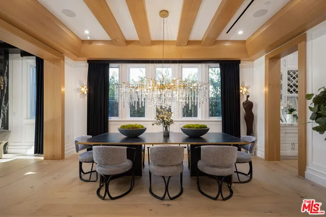 a view of a dining room with furniture and window